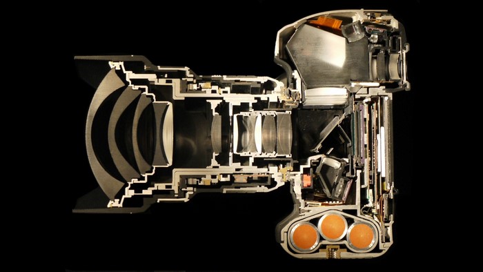 Cutaway of a digital camera with lens