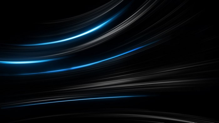 Abstract blue and white light streaks on black background