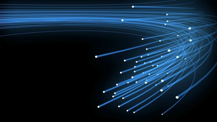 Abstract blue fiber optics with glowing dots on black background