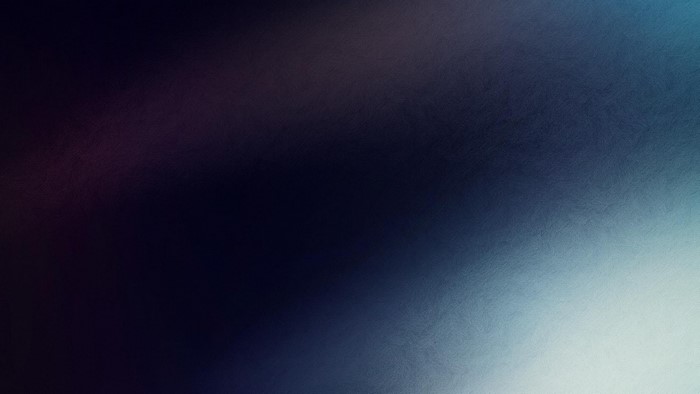 Dark blue and purple gradient with light flare