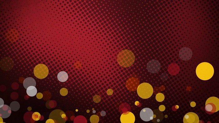Red and yellow bokeh circles on a dotted background
