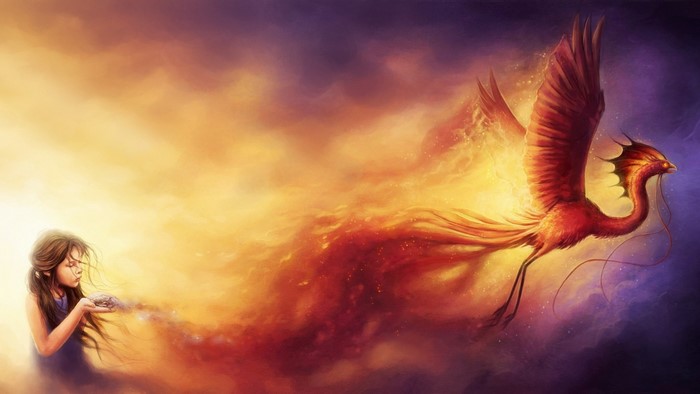 Girl releasing a phoenix from her hands