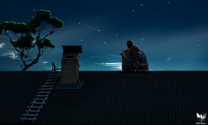 Couple watching stars on a rooftop at night