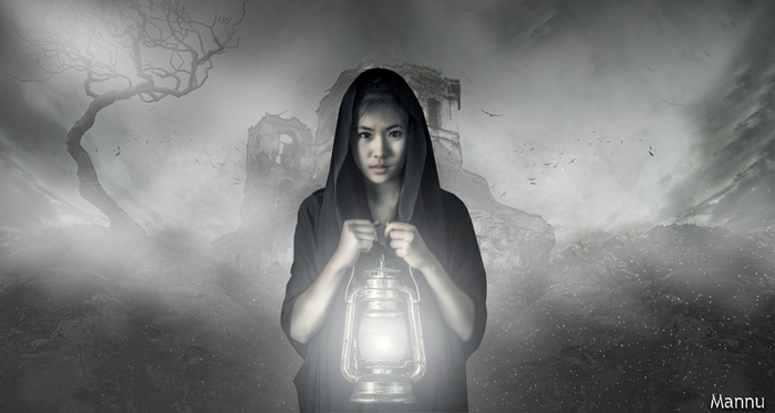 Girl in black hood holding lantern in front of ruins