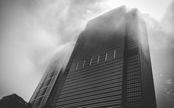 Monochrome skyscraper shrouded in mist