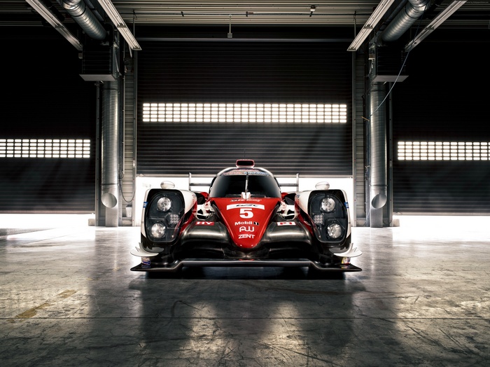 Toyota TS050 Hybrid race car in garage