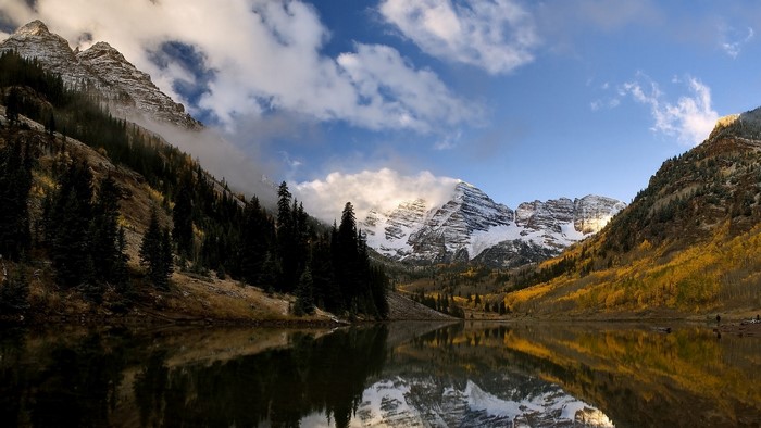 Maroon Bells mountains reflected in lake during fall