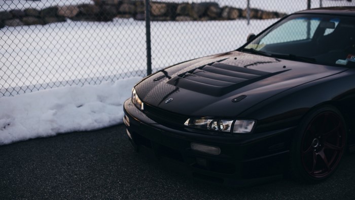 Black Nissan Silvia S14 Kouki sports car with custom hood