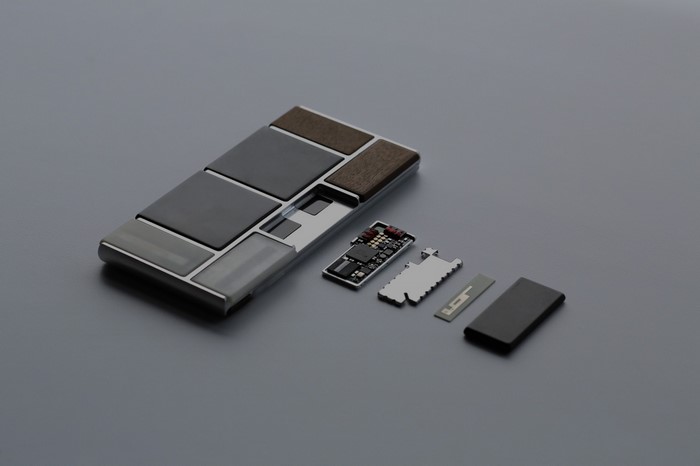 Modular phone components on a gray surface
