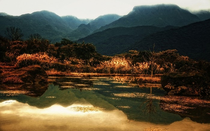 Mountains reflected in a lake at sunset