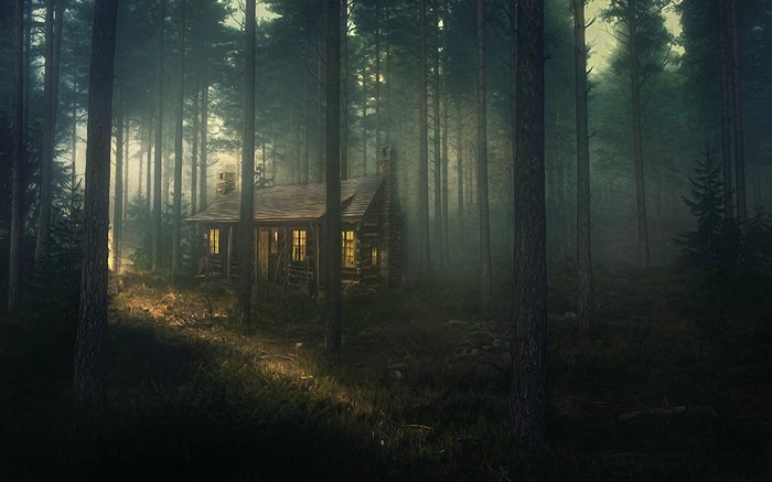 Log cabin in a misty forest with sunlight
