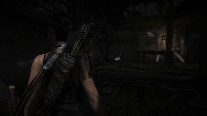 Lara Croft from Tomb Raider in a dark room