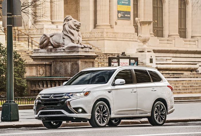 White Mitsubishi Outlander PHEV parked in front of New York Public Library
