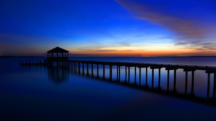 Pier with Gazebo at Dusk Over Calm Water