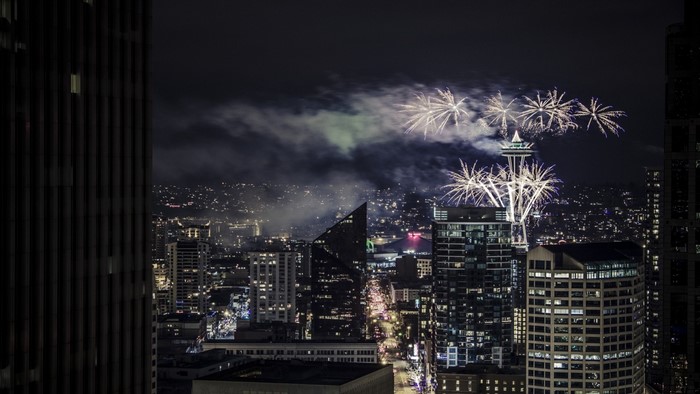Seattle skyline with Space Needle and fireworks at night