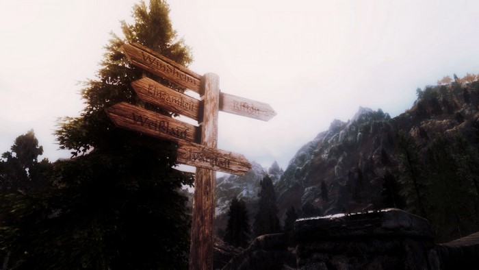 The Elder Scrolls V Skyrim wooden signpost in mountains