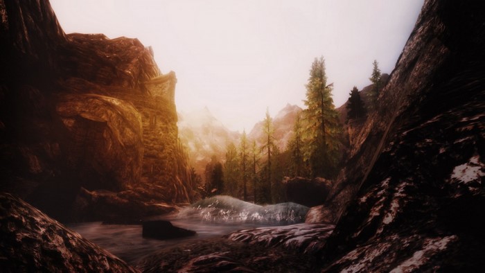 The Elder Scrolls V Skyrim screenshot of a misty mountain valley