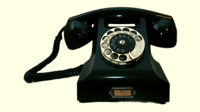 Black rotary dial telephone