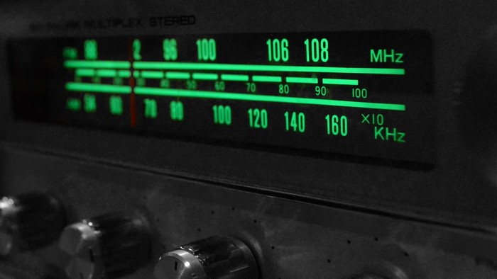 Close-up of a vintage radio tuner display