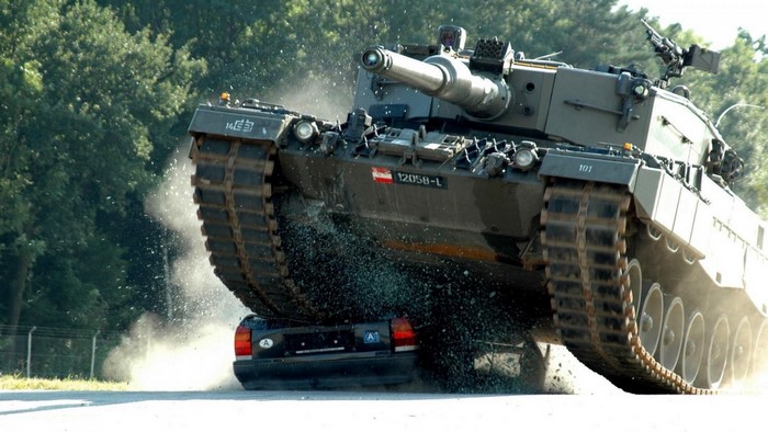 Leopard 2 tank crushing a car