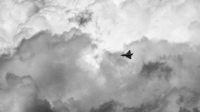 Eurofighter Typhoon flying through clouds