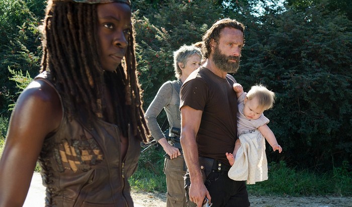 Michonne, Rick Grimes, and Carol Peletier with a baby from The Walking Dead