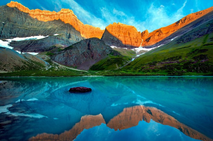 Sunset Over Glacier National Park Mountains and Lake