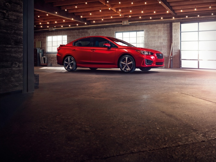 Red Subaru Impreza Sedan in Garage