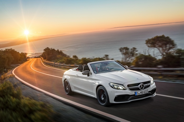 White Mercedes-AMG C 63 S Cabriolet on Coastal Road