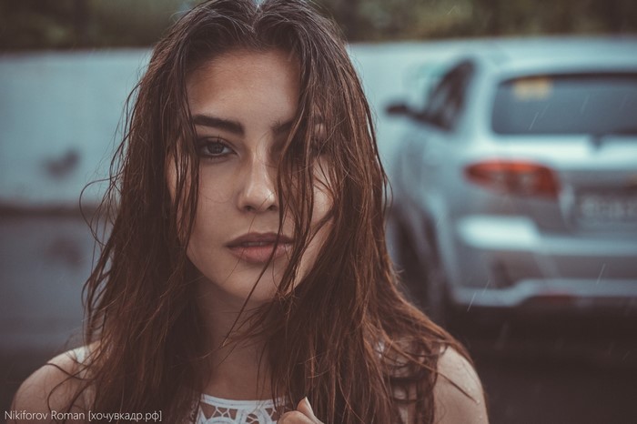 Woman with wet hair in the rain