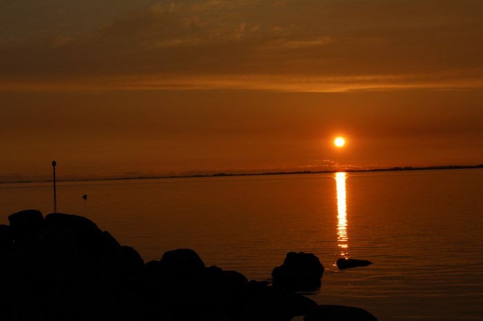 Sunset over the sea with a reflection on the water