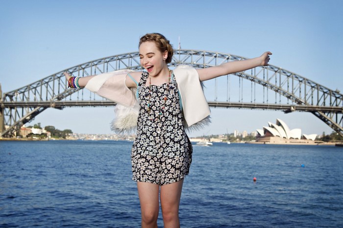 Sabrina Carpenter in Sydney with Opera House and Harbour Bridge