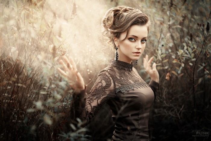 Woman with blue eyes and vintage dress in outdoors