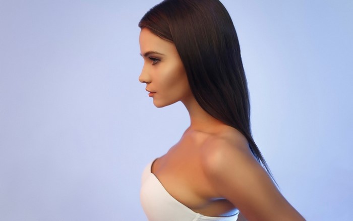 Woman with long brown hair in profile
