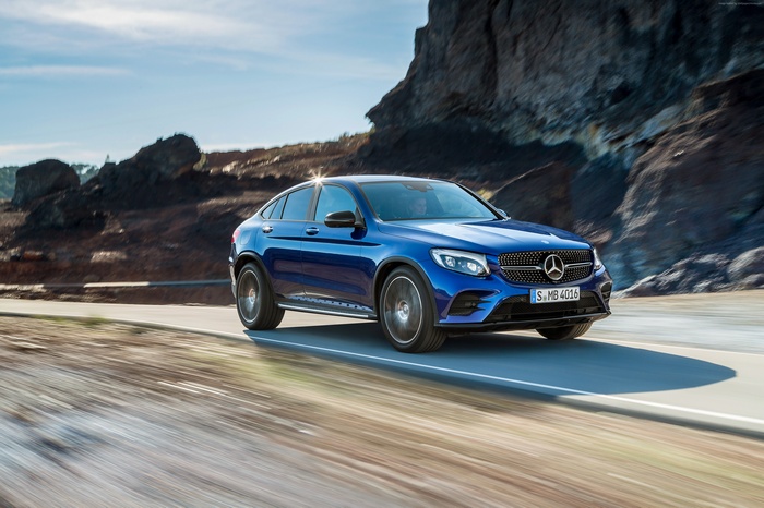 Blue Mercedes-Benz GLC Coupe driving on a road