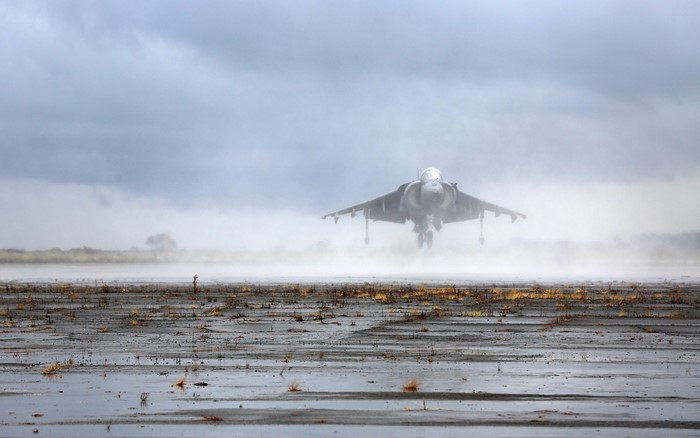 AV-8B Harrier II jet aircraft taking off in mist