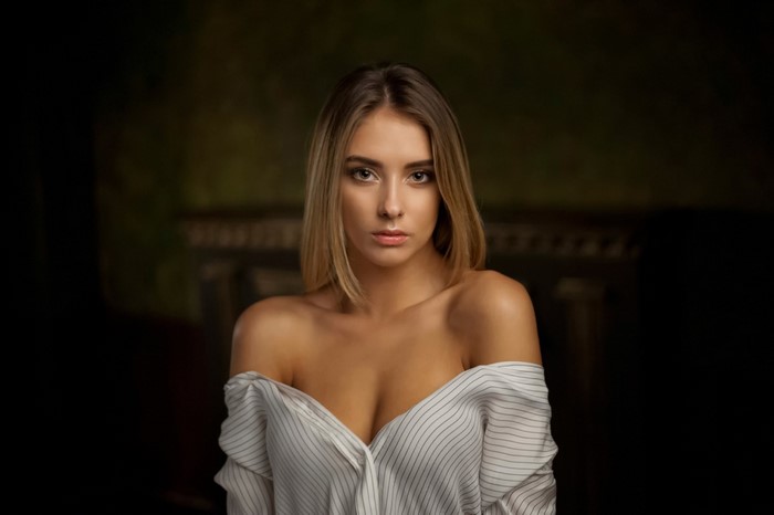 Portrait of a Woman in Off-Shoulder Striped Shirt