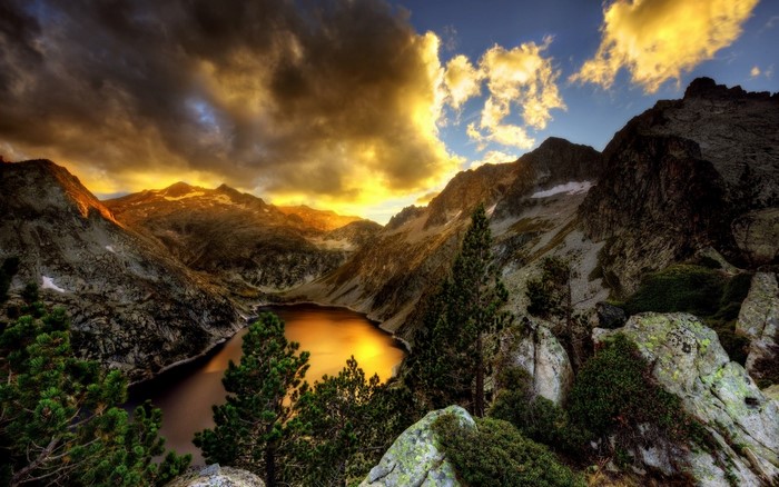 Mountain range with lake at sunset