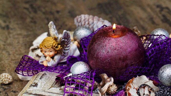 Christmas candle arrangement with angel and ornaments