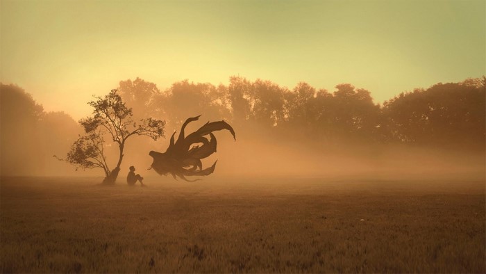 Fantasy creature and person in a misty field at sunrise