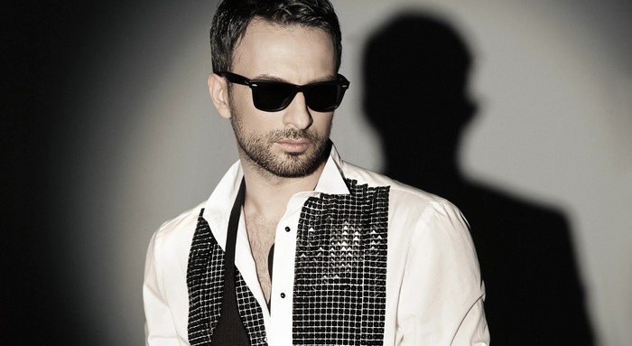 Man wearing sunglasses and a white shirt