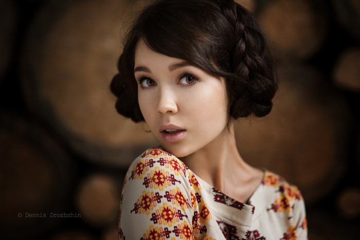 Portrait of a young woman with braided hair
