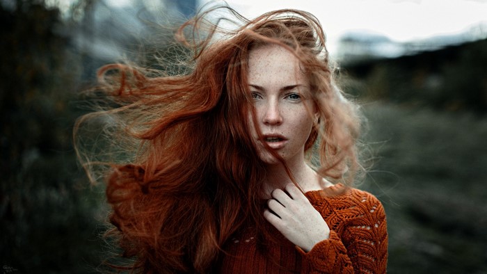 Portrait of Redhead Woman in Windy Autumn Outdoors
