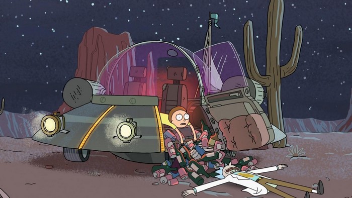 Rick and Morty in a desert landscape with a crashed vehicle