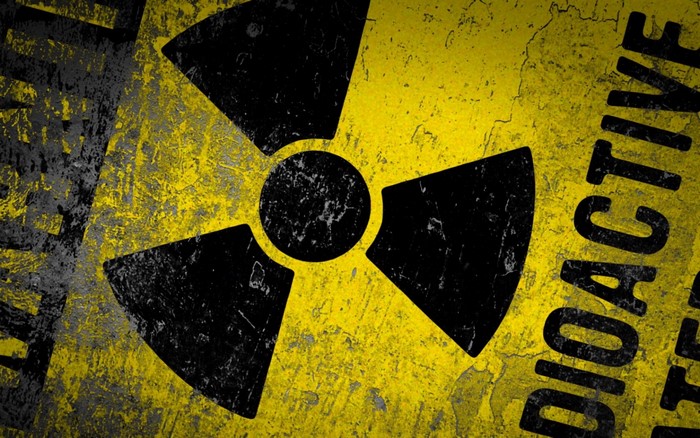 Radioactive symbol on a grunge yellow background