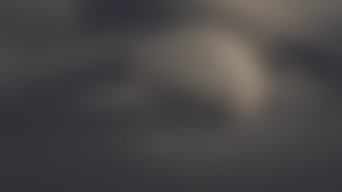 Blurred dark texture with light