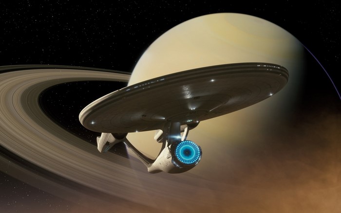 USS Enterprise spaceship near Saturn