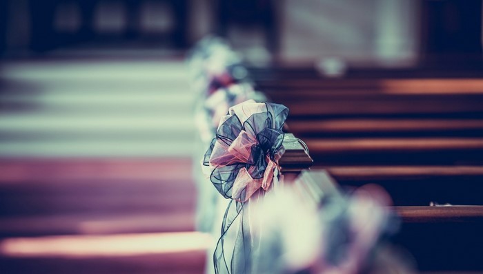Wedding pew decorations in a church