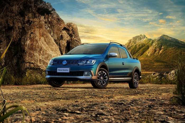 Blue Volkswagen Saveiro Cross CD pickup truck in mountains
