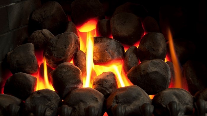 Fireplace with glowing stones and flames